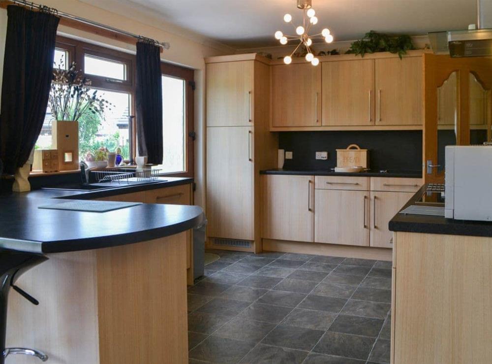 Lovely tile-floored kitchen area at Riverside in Brydekirk, Annon, Dumfriesshire