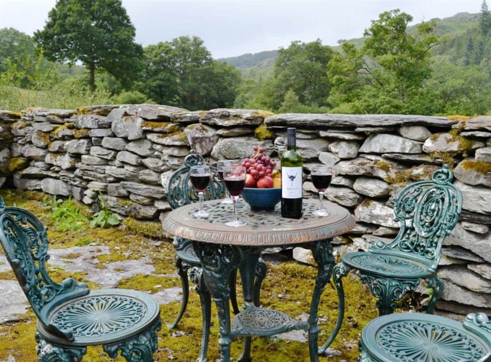 Outdoor furniture in courtyard at Riverside Cottage in Betws-y-Coed, Gwynedd