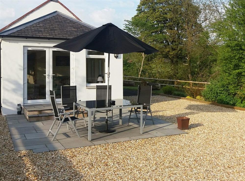 Delightful patio with sitting out area at Riverside Cottage in Boreland, near Lockerbie, Dumfries and Galloway, Dumfriesshire