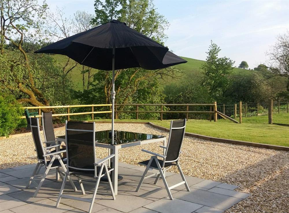 Patio area with glorious views of the surrounding area at Riverside Cottage in Boreland, near Lockerbie, Dumfries and Galloway, Dumfriesshire