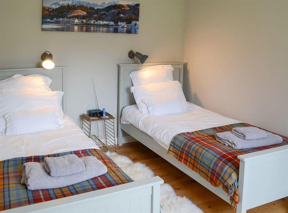 Comfortable twin bedroom at Riverside Cottage in Inchnadamph, near Lochinver, Sutherland