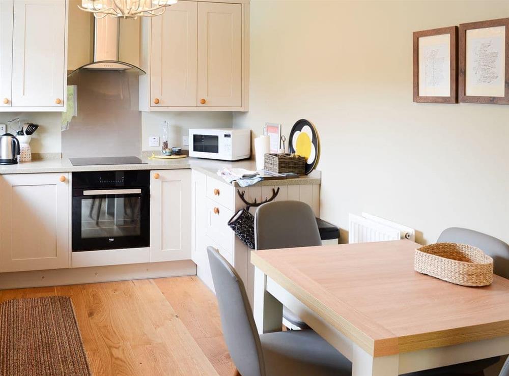 Spacious kitchen with breakfast area (photo 2) at Riverside Cottage in Inchnadamph, near Lochinver, Sutherland