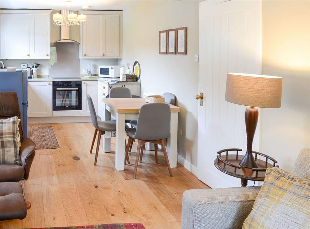 Spacious kitchen with breakfast area at Riverside Cottage in Inchnadamph, near Lochinver, Sutherland