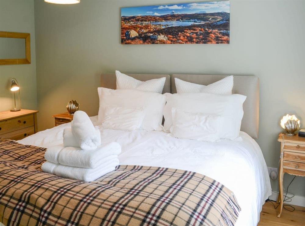 Warm and inviting double bedroom at Riverside Cottage in Inchnadamph, near Lochinver, Sutherland
