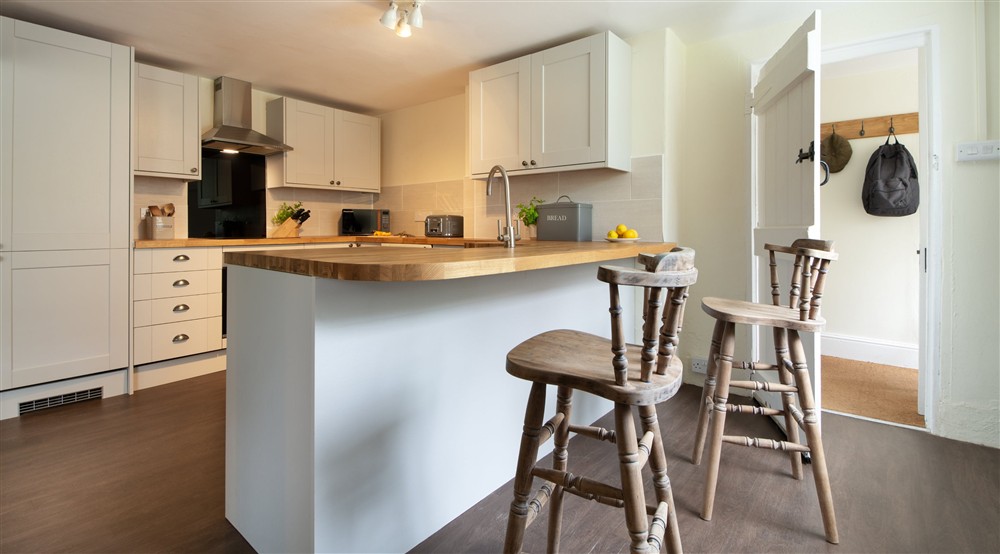 The open-plan kitchen, sitting and dining room at Riverside Cottage in Lynton, North Devon