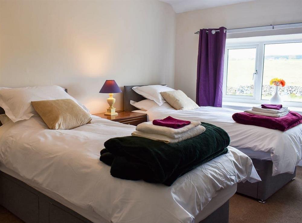 Twin bedroom at Riverside Cottage in Maulds Meaburn in the Eden Valley, Cumbria