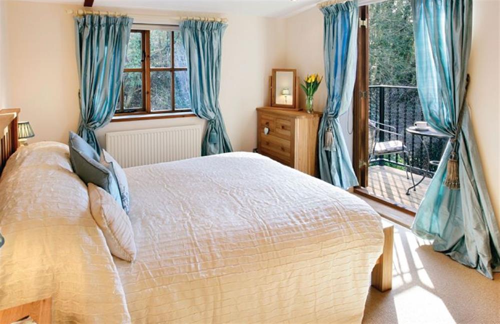 First floor:  Master bedroom with 5ft bed and balcony at Riverside Cottage, Syleham near Eye