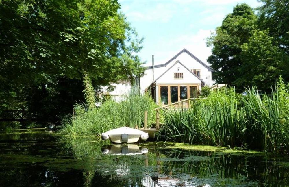 Riverside Cottage: Private jetty and a small, private island accessed via a wooden bridge at Riverside Cottage, Syleham near Eye