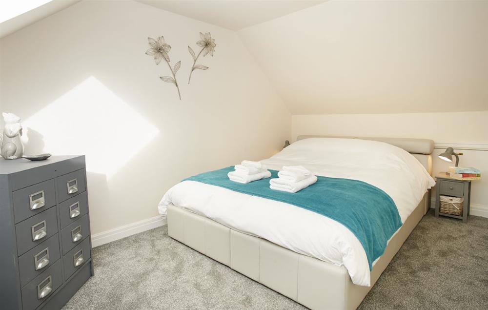 Double bedroom with king-size bed at Riverside Farm Cottage, Kirby Mills, Kirkbymoorside