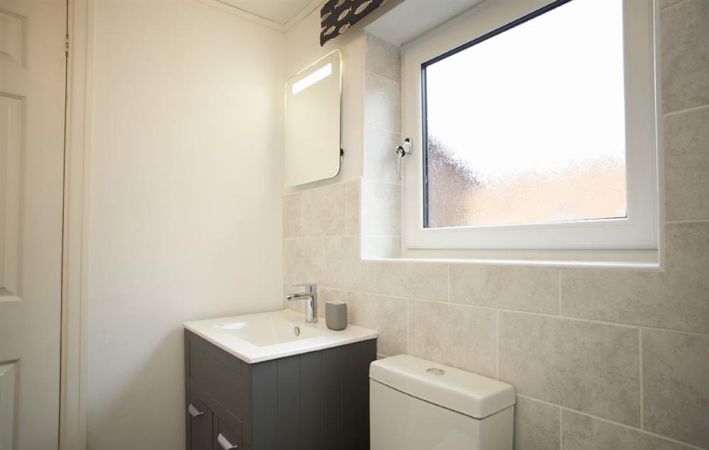 Family bathroom with bath and separate walk in shower. (photo 2) at Riverside Farm Cottage, Kirby Mills, Kirkbymoorside