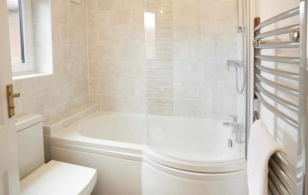 Family bathroom with bath and separate walk in shower. at Riverside Farm Cottage, Kirby Mills, Kirkbymoorside