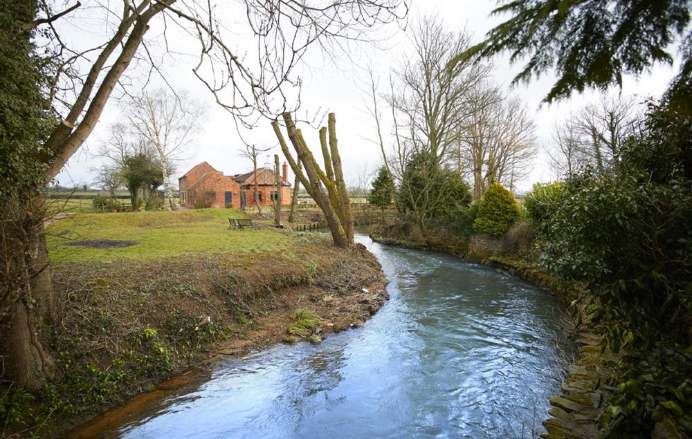 The River Dove runs through the grounds at Riverside Farm Cottage, Kirby Mills, Kirkbymoorside