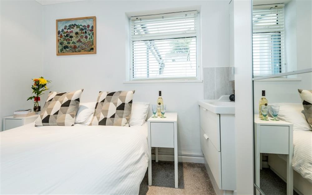 The master bedroom has a useful vanity unit. at Riverside in Helford Passage