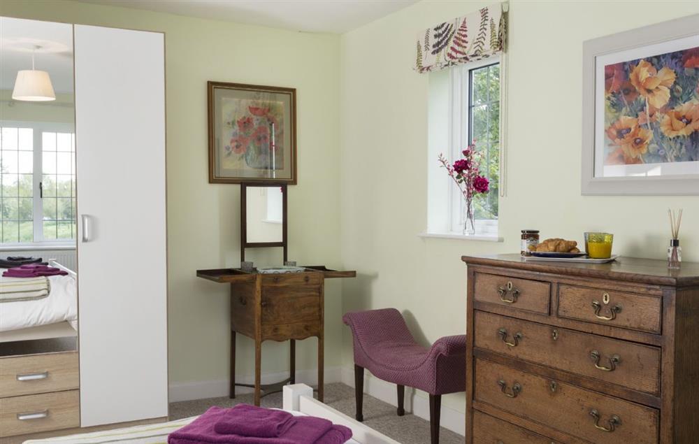 Double bedroom with period furniture including an antique wash stand at Riverside House, Bidford-on-Avon