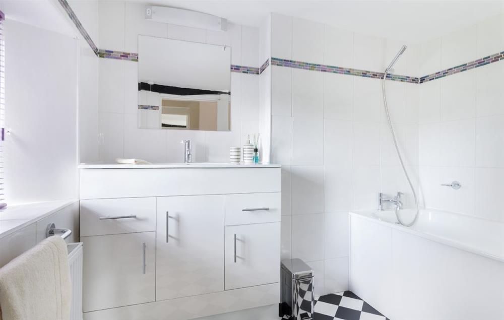Family bathroom with bath and shower over at Riverside House, Bidford-on-Avon