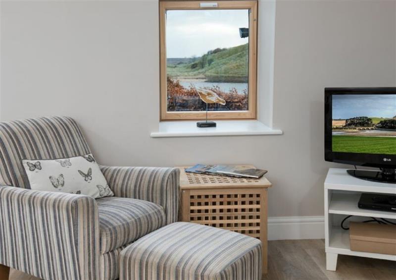 Relax in the living area at Riverside Lodge, Alnmouth