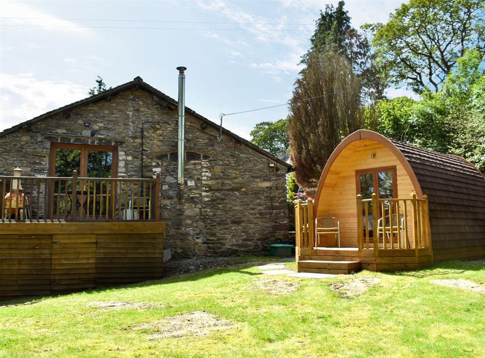 Lawned garden with patio, garden furniture and gas BBQ at Riverside Mill & Glamping Pod in Patton, near Kendal, Cumbria