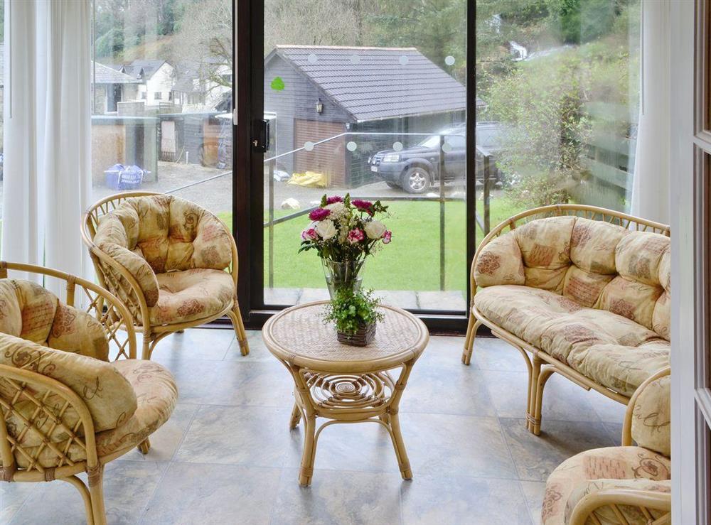 Comfortable seating in conservatory at Riverside Villa in Liskeard, Cornwall