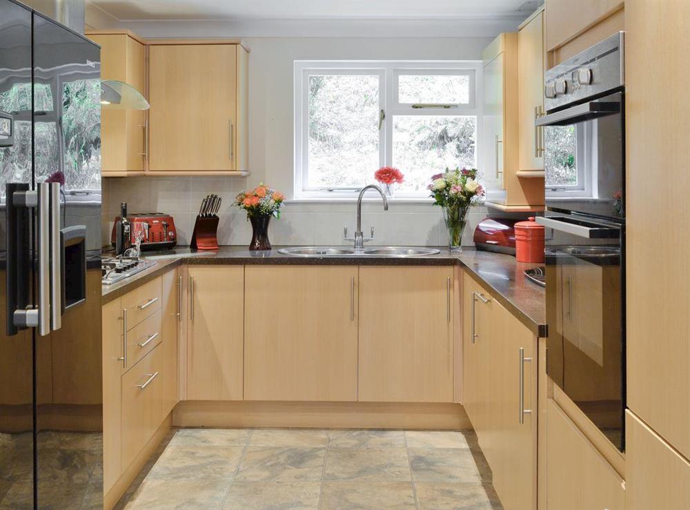 Well-equipped fitted kitchen at Riverside Villa in Liskeard, Cornwall