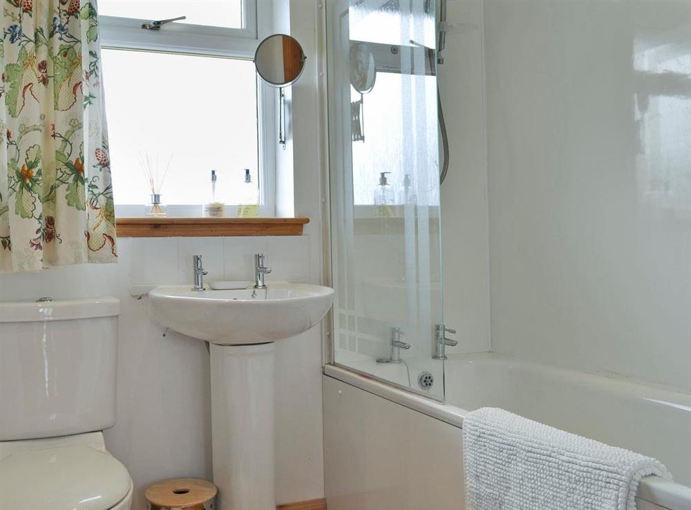 Bathroom with shower over bath at Riverview Cottage in Acharacle, Argyll