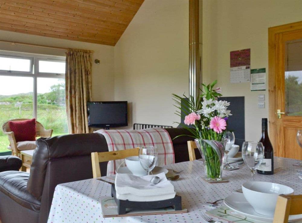 Dining area within open-plan living room at Riverview Cottage in Acharacle, Argyll