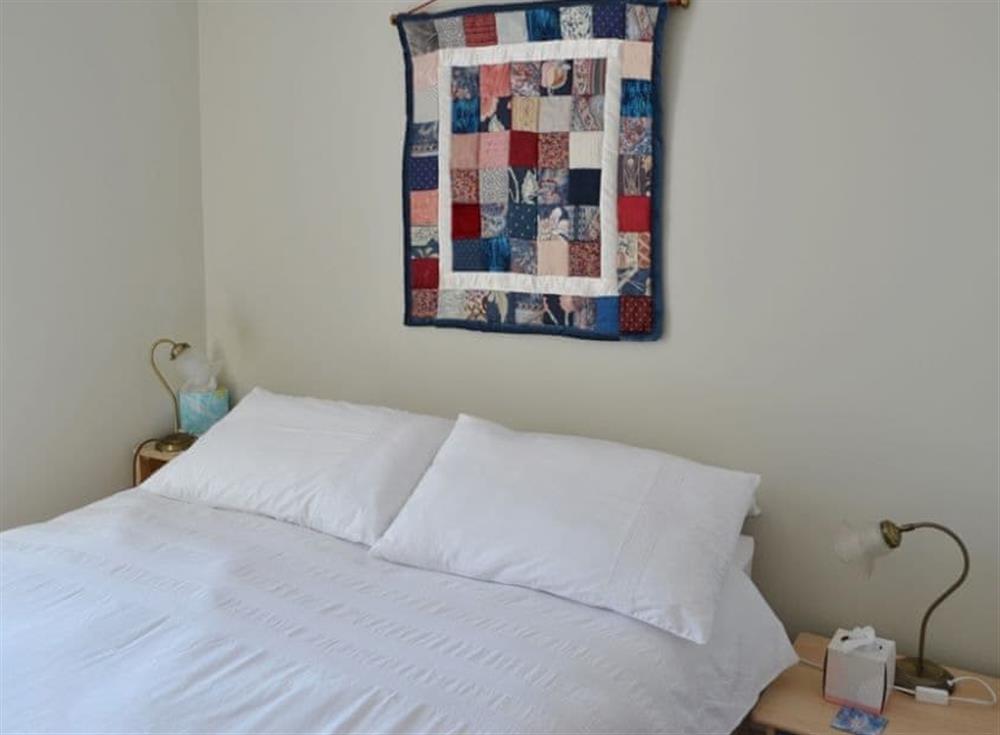 : Cosy double bedroom with en-suite shower room at Roadstead in Fowey, Cornwall