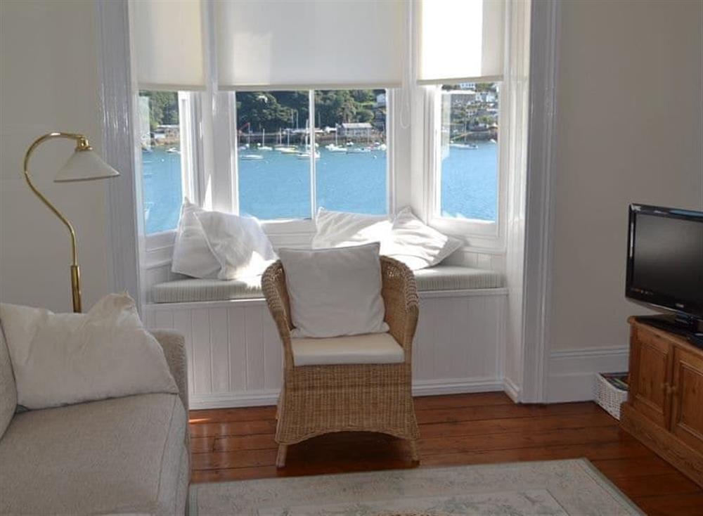 The sitting room has fabulous views overlooking the river at Roadstead in Fowey, Cornwall