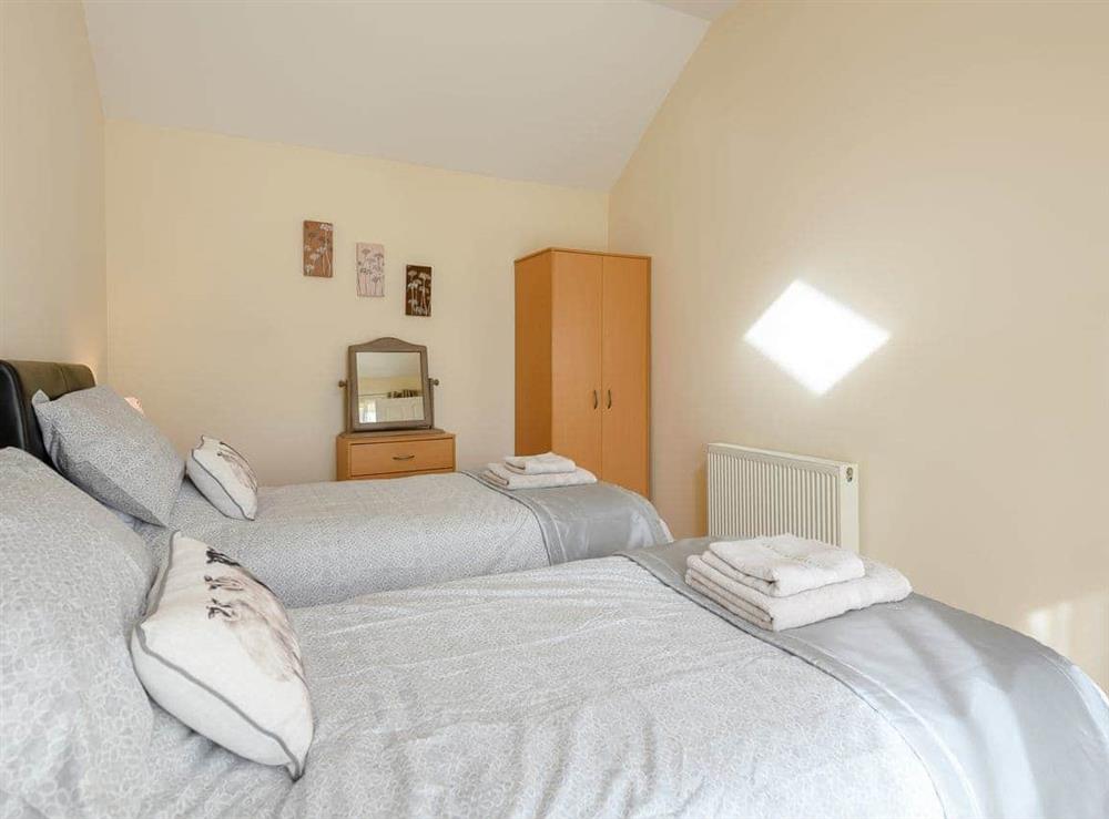 Charming bedroom with twin single beds at Robins Barn in Skegness, Lincolnshire