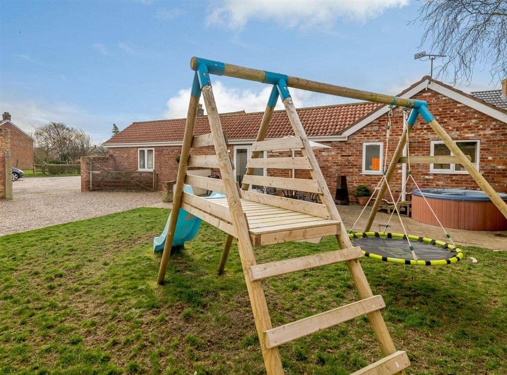 Children’s play equipment in the garden at Robins Barn in Skegness, Lincolnshire