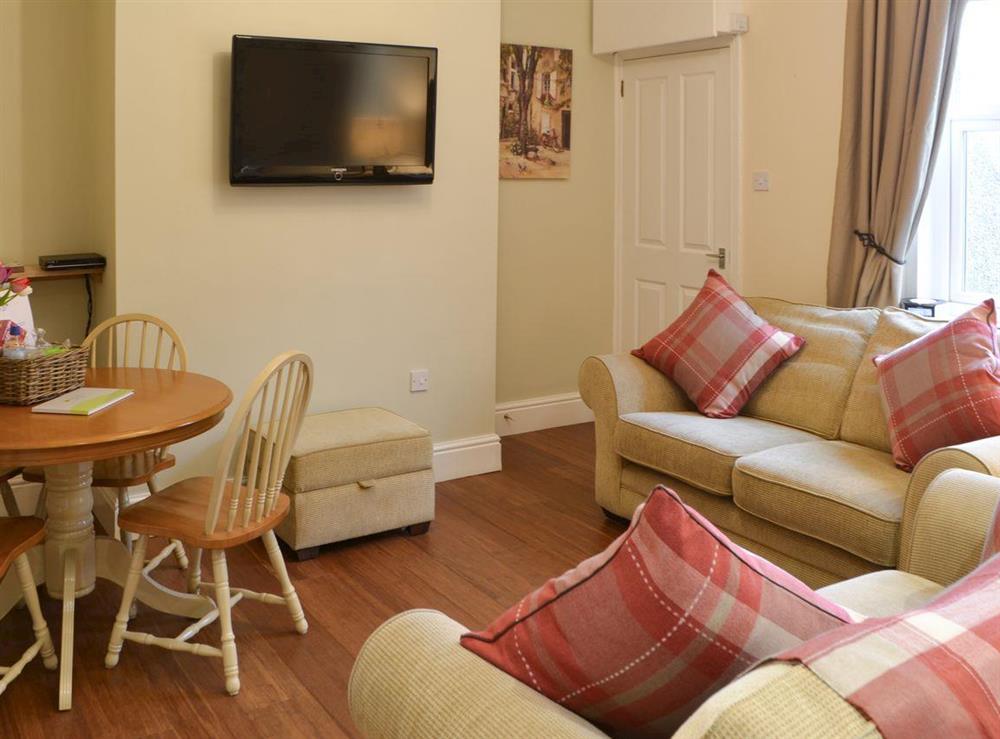 Lounge with dining area at Robins Nest in Broomhill, near Amble, Northumberland