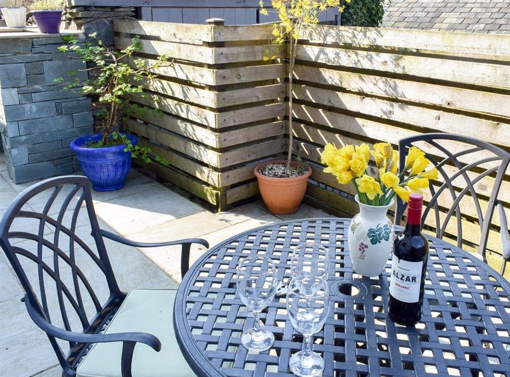 Enclosed courtyard patio with garden furniture (photo 2) at Rock Cottage in Kendal, Cumbria