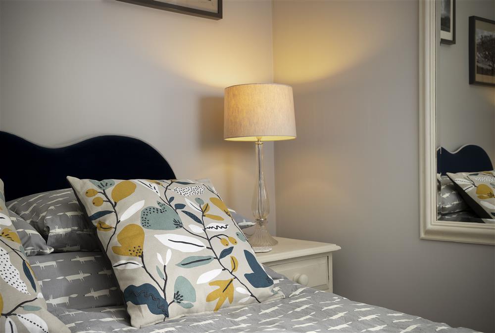 First floor: Bedroom one with all feather bedding to guarantee a good nights sleep at Rock Cottage, Minchinhampton