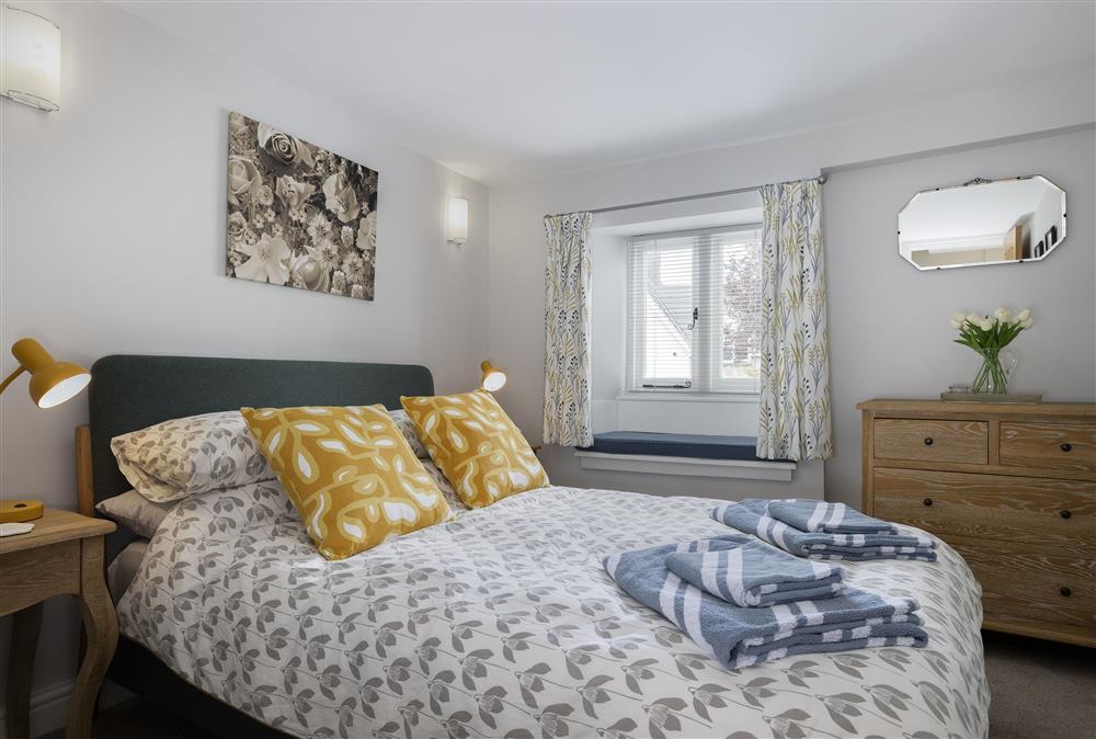First floor: Bedroom two is elegantly furnished with a 4ft6 double bed at Rock Cottage, Minchinhampton