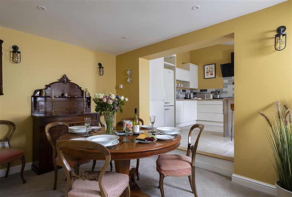 Ground floor: The traditional dining room has a table with seating for four guests at Rock Cottage, Minchinhampton