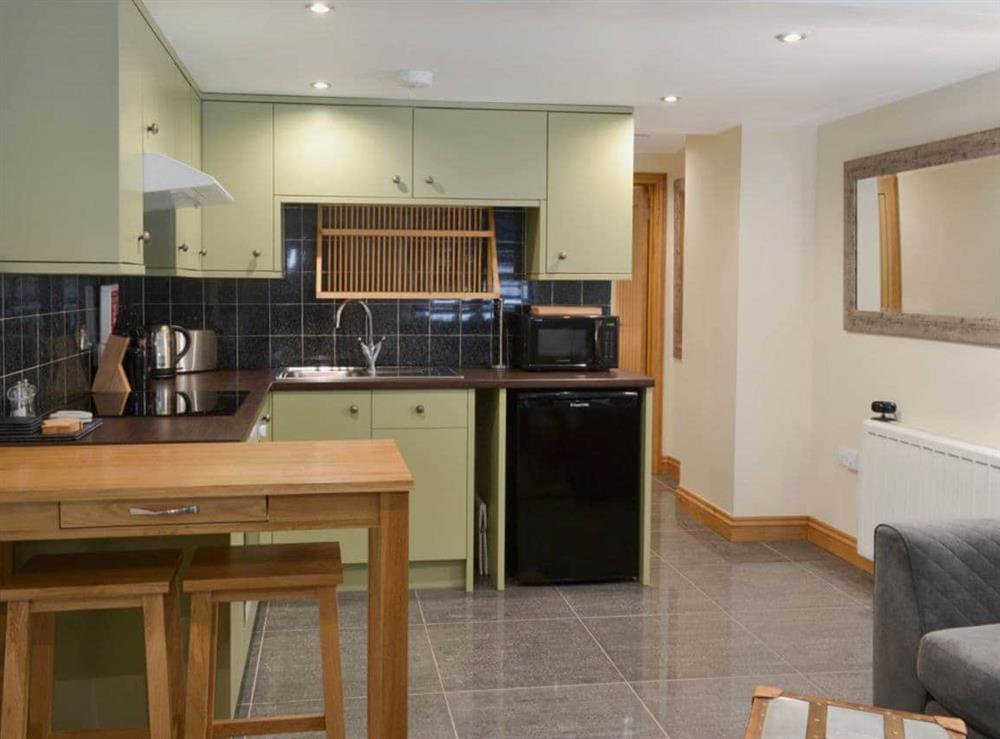 Open plan living/dining room/kitchen at Rockfish Cottage in Brixham, Devon
