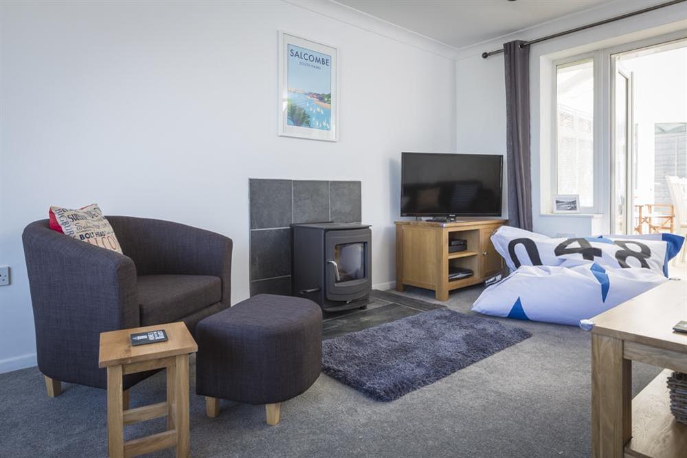 Comfortable sitting room with feature wood-burning stove at Rockpoint in , Salcombe