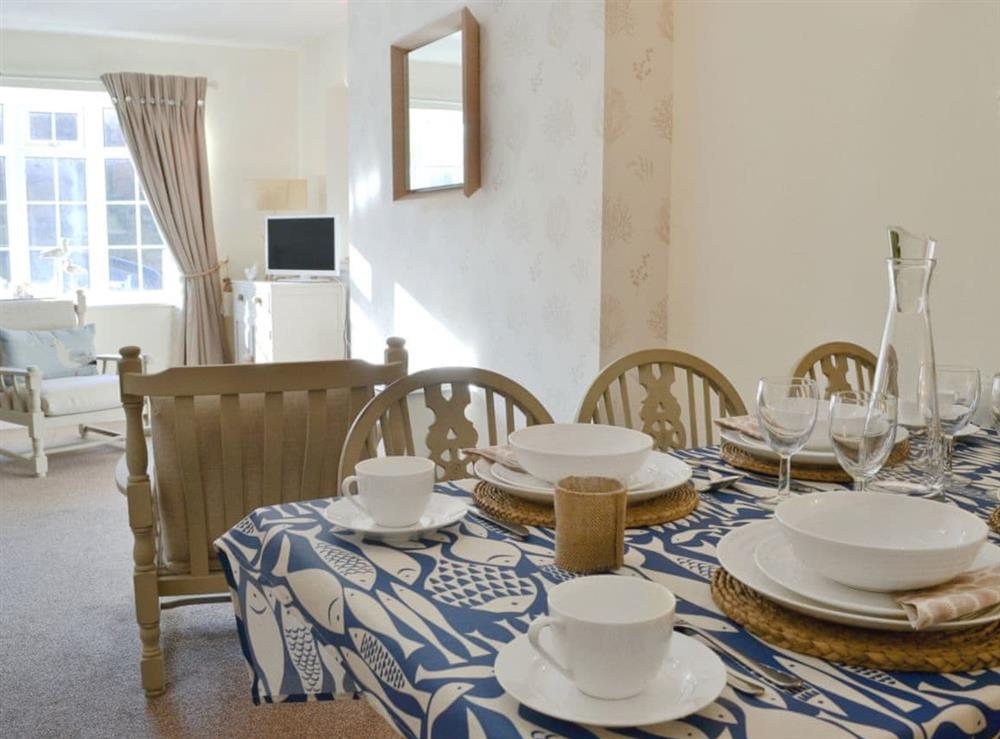 Dining area looking towards the living room at Rockpool Cottage in Saltburn-by-the-Sea, North Yorkshire