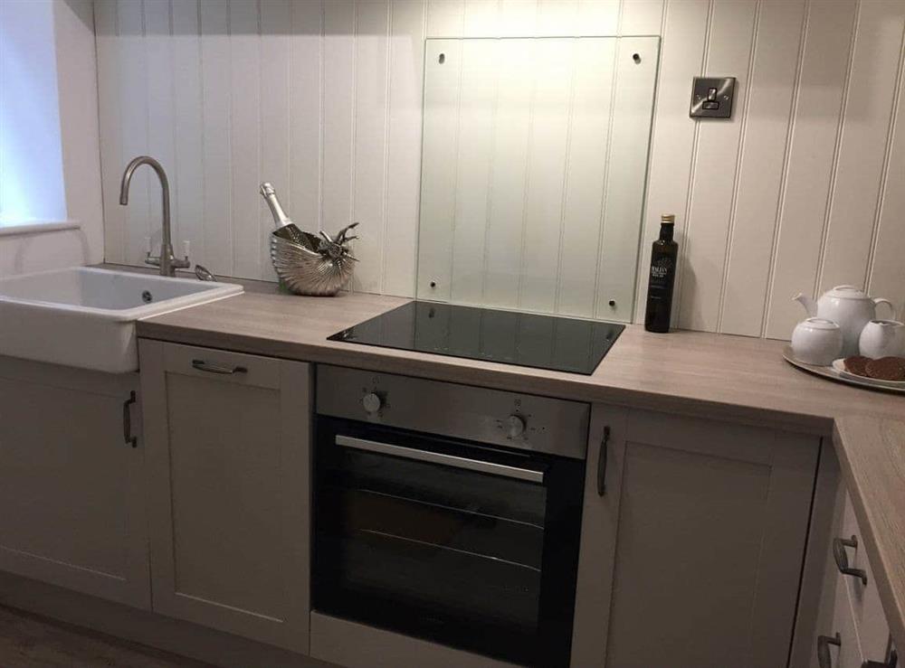 Modern galley style kitchen at Rockpool Cottage in , Staithes near Whitby