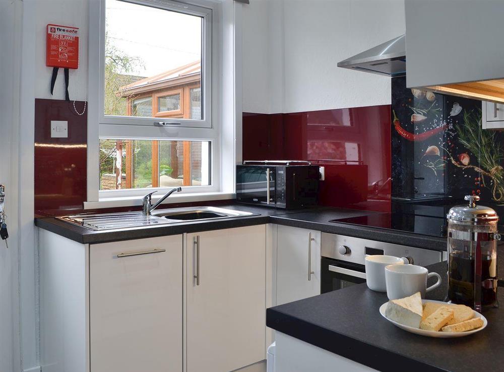 Kitchen with direct access to the rear garden at Rocky Mountain View in Ballachulish, Highlands, Argyll