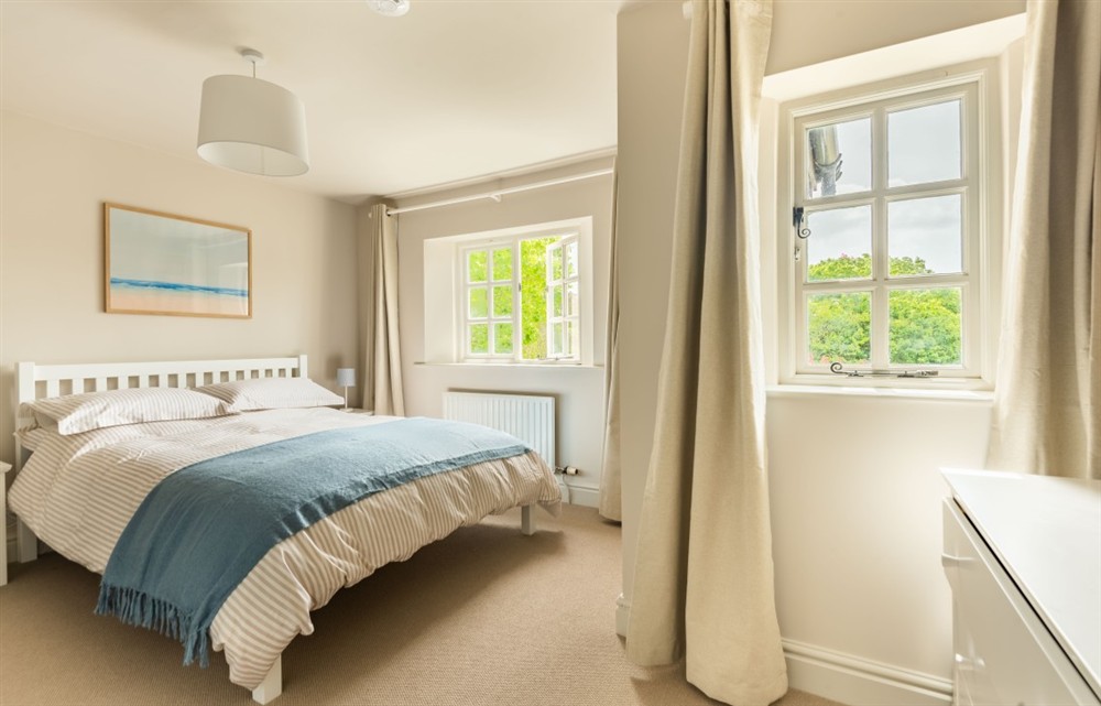One of the bedrooms at Rocky's Cottage in Thurlestone
