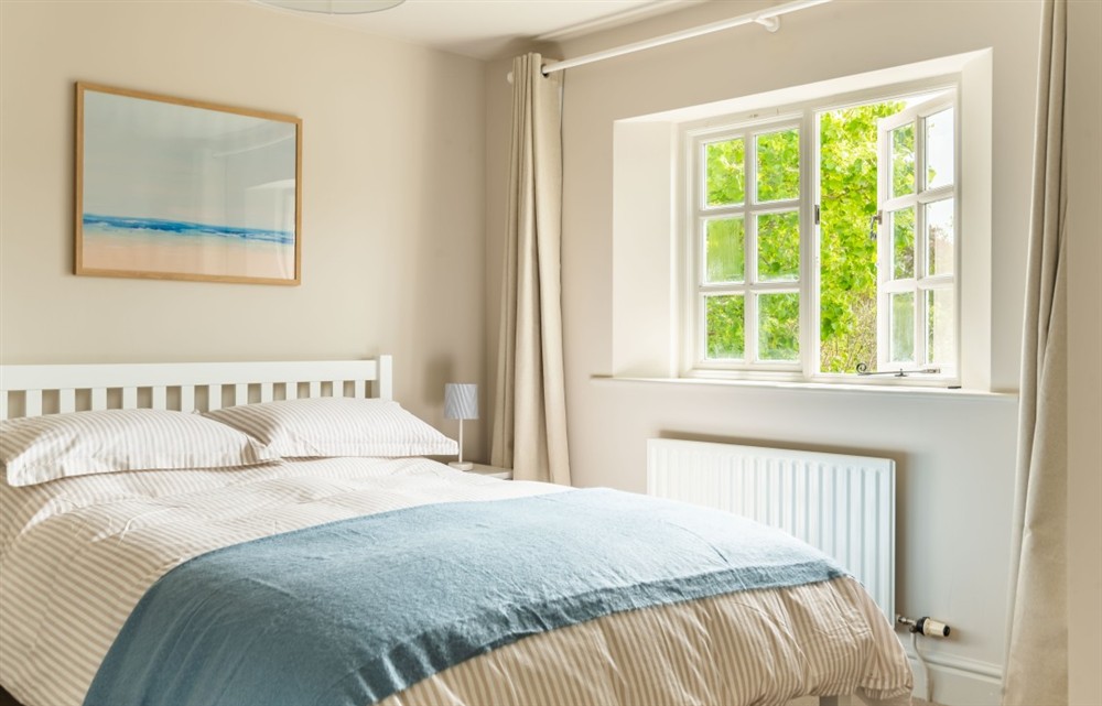 This is a bedroom at Rocky's Cottage in Thurlestone