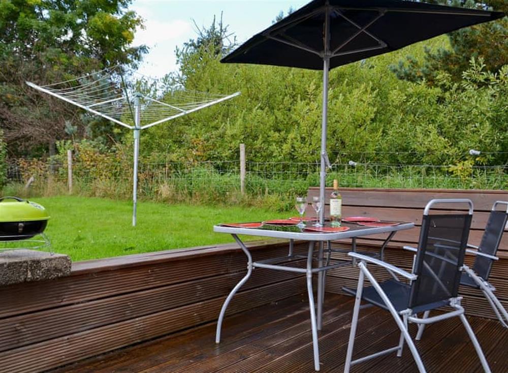 Enclosed lawned garden with sitting-out area and garden furniture (photo 2) at Roe Deer Cottage in Broallan, near Beauly, Inverness-Shire
