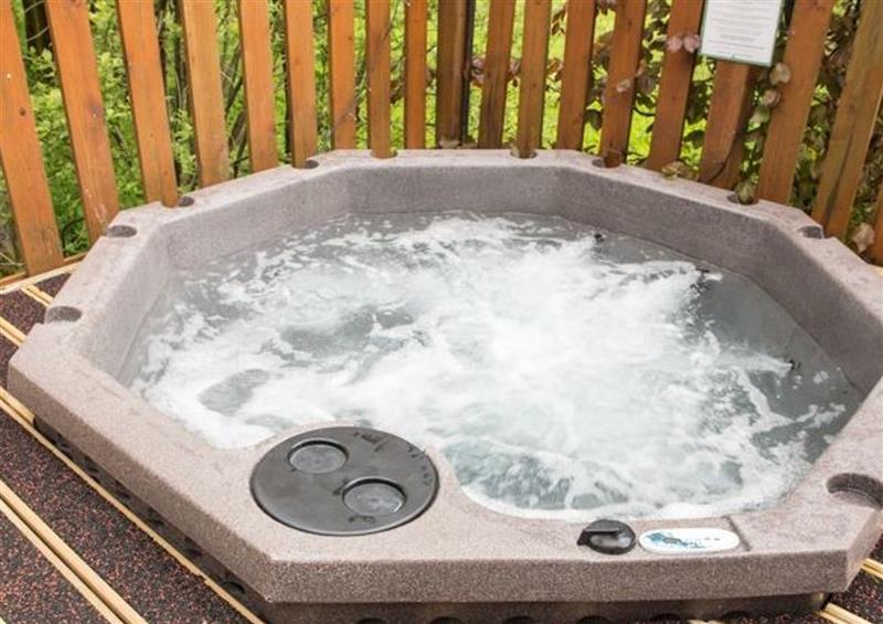 Spend some time in the hot tub at Roe Deer Lodge, Kirkstone 28