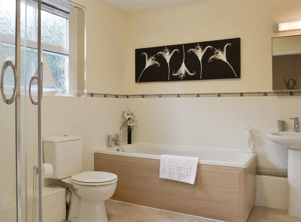 Family bathroom with bath and separate shower cubicle at Rolton House in Ambleside, Cumbria