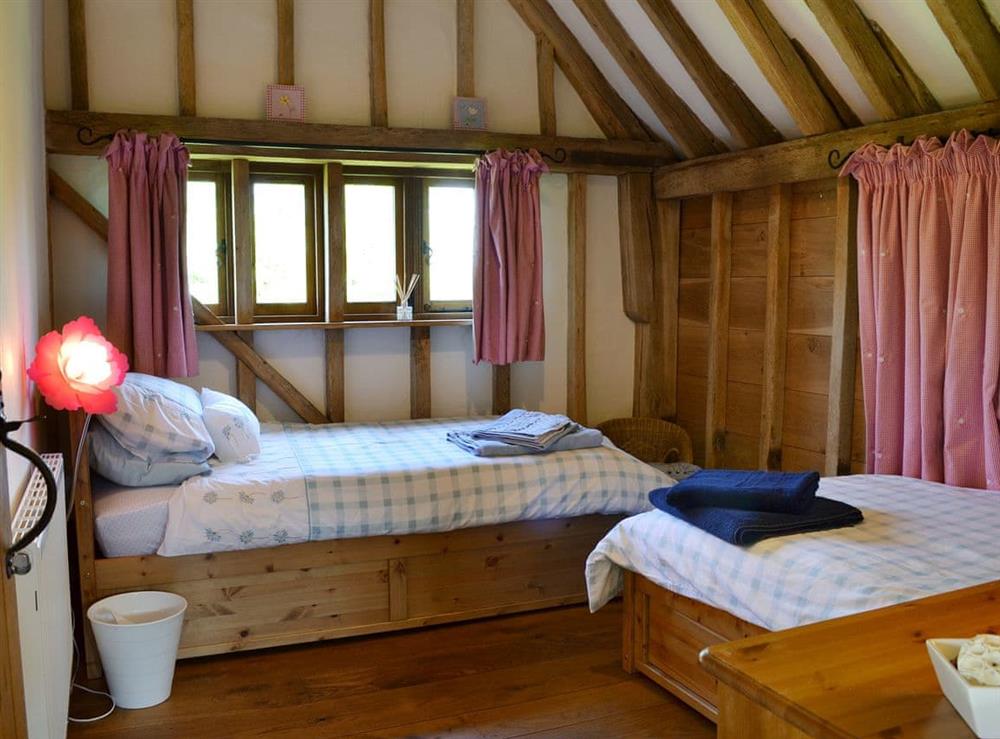 Charming twin bedroom at Romden Barn in Smarden, near Ashford, Kent