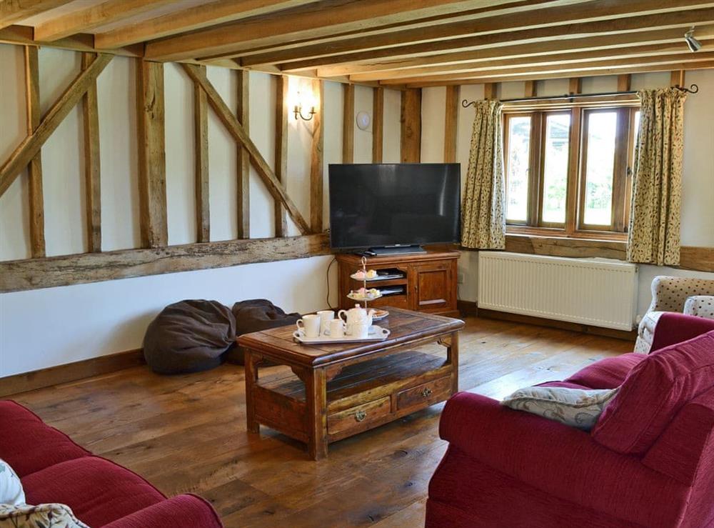 Superbly renovated living area with beams at Romden Barn in Smarden, near Ashford, Kent