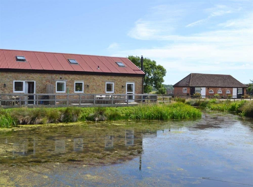 View of all 4 properties situated on the edge of a beautiful pond at The Wagon Lodge, 