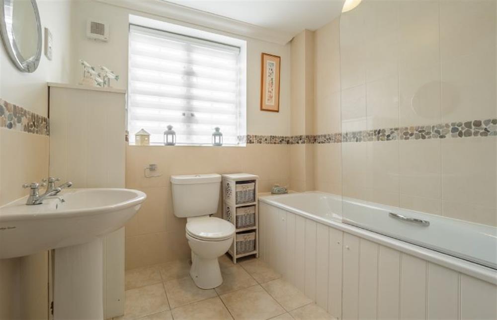 First floor: Family bathroom with bath and shower over at Roof Top View, Wells-next-the-Sea