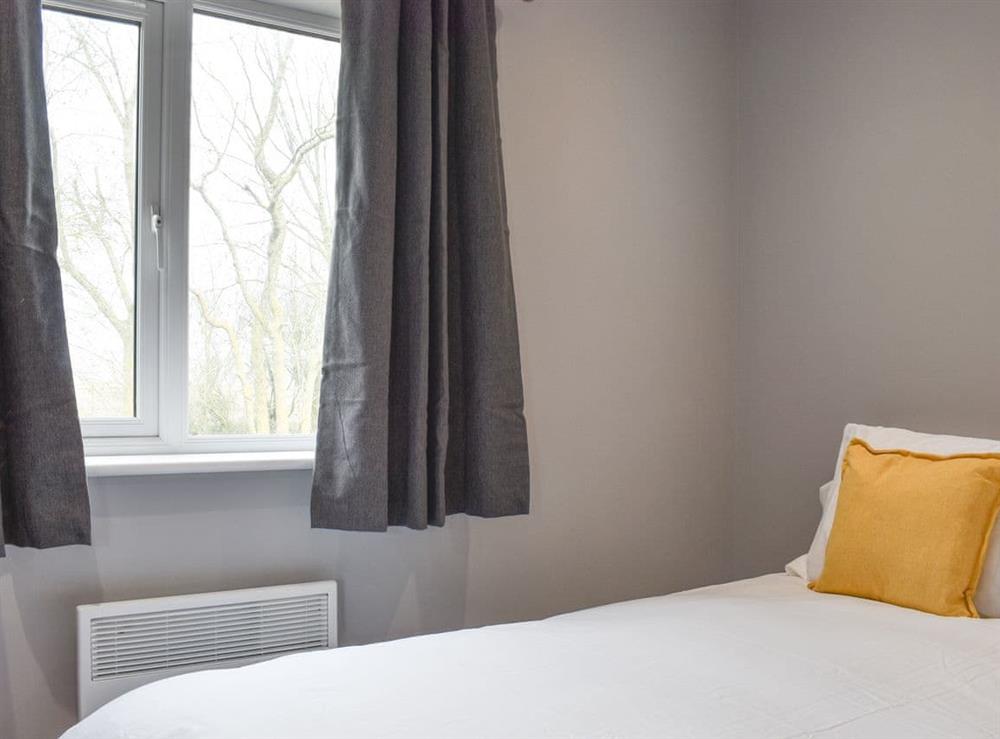 Relaxing double bedroom at Badger Lodge, 