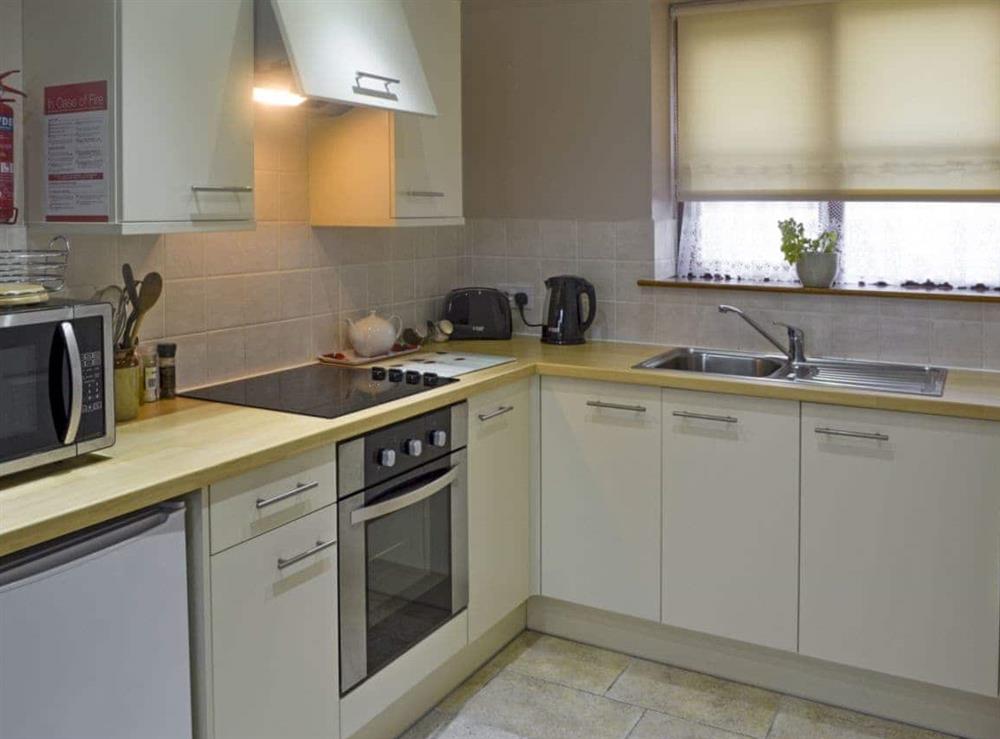 Well-equipped fitted kitchen at Clougha View, 